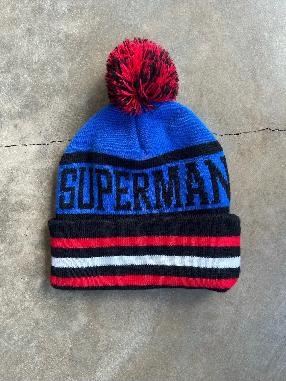DC Comics Superman Knit Pom Beanie Hat - Blue, Red, Black, White, Yellow